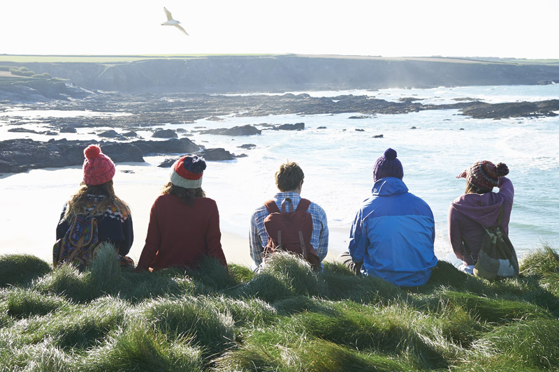 Students sitting on a cliff Students sitting on a cliff