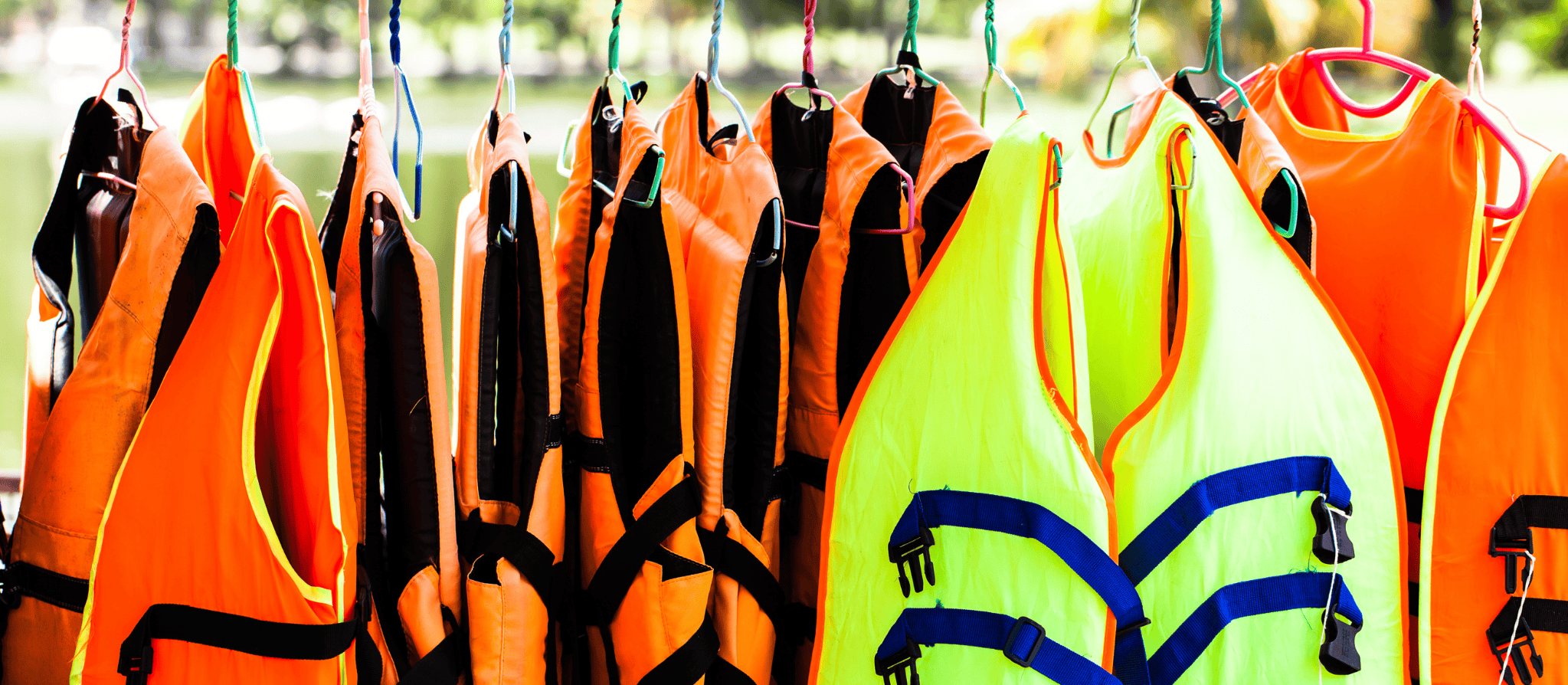 Buoyancy aids hanging on a rack