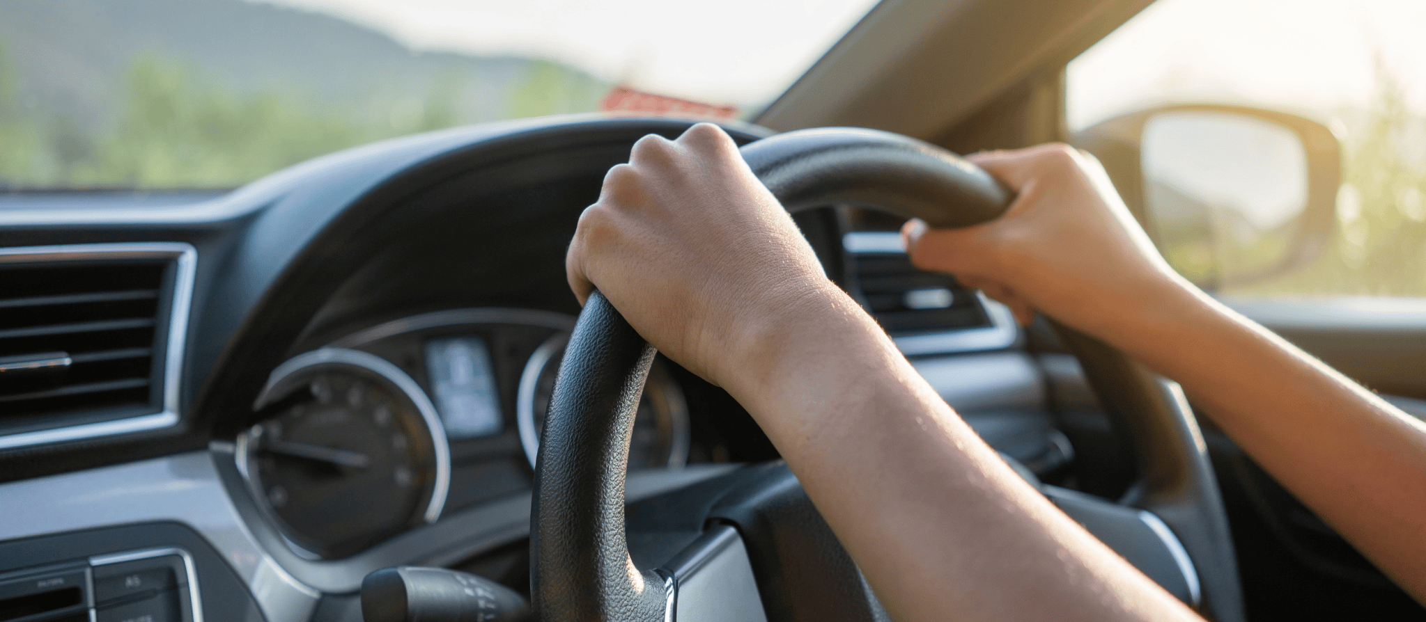 Driving a car hand on wheel